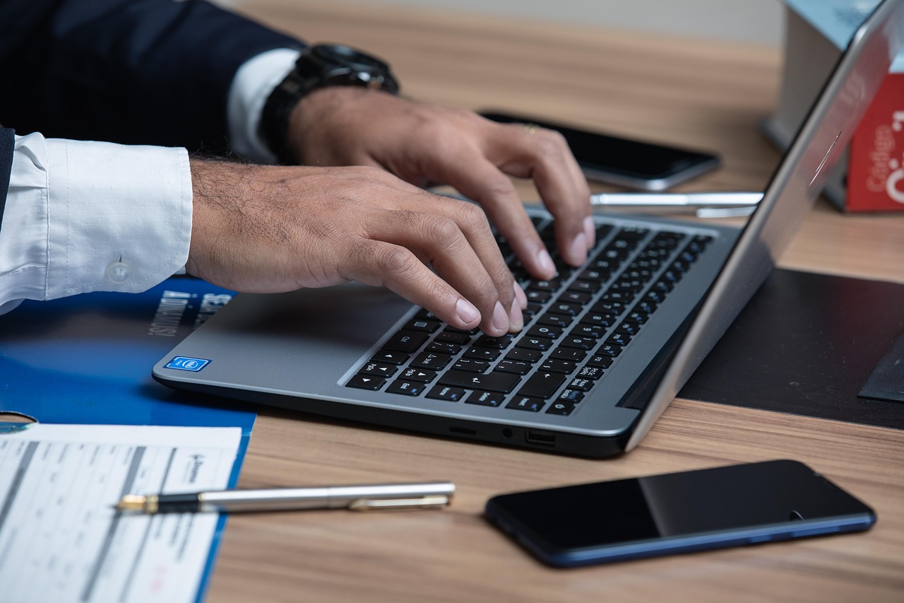 image of a business person typing on a keyboard - Aggressive Injury Lawyer